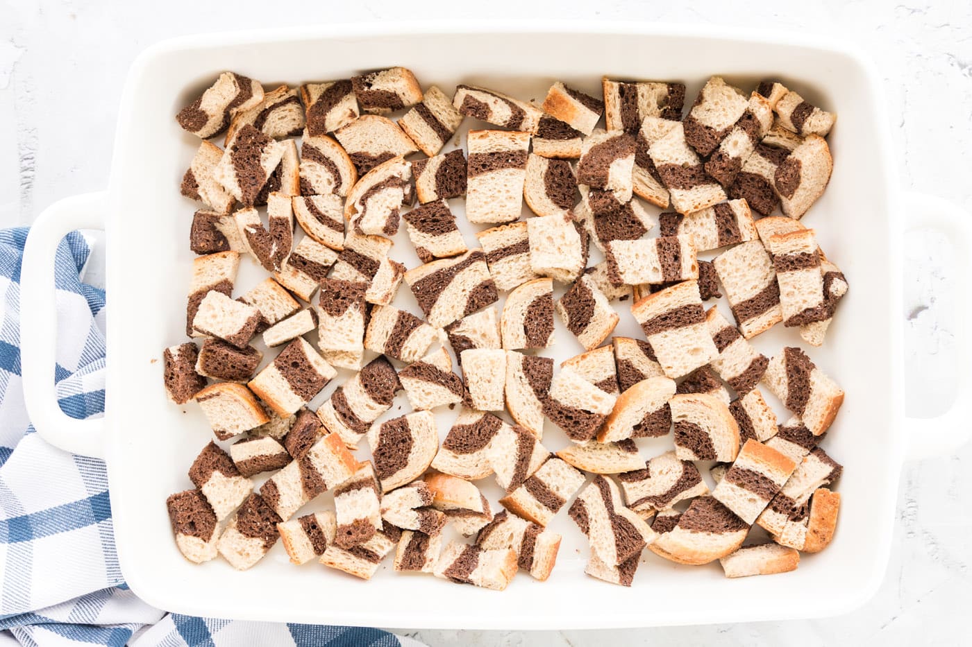 layer of cubed rye bread in a baking dish