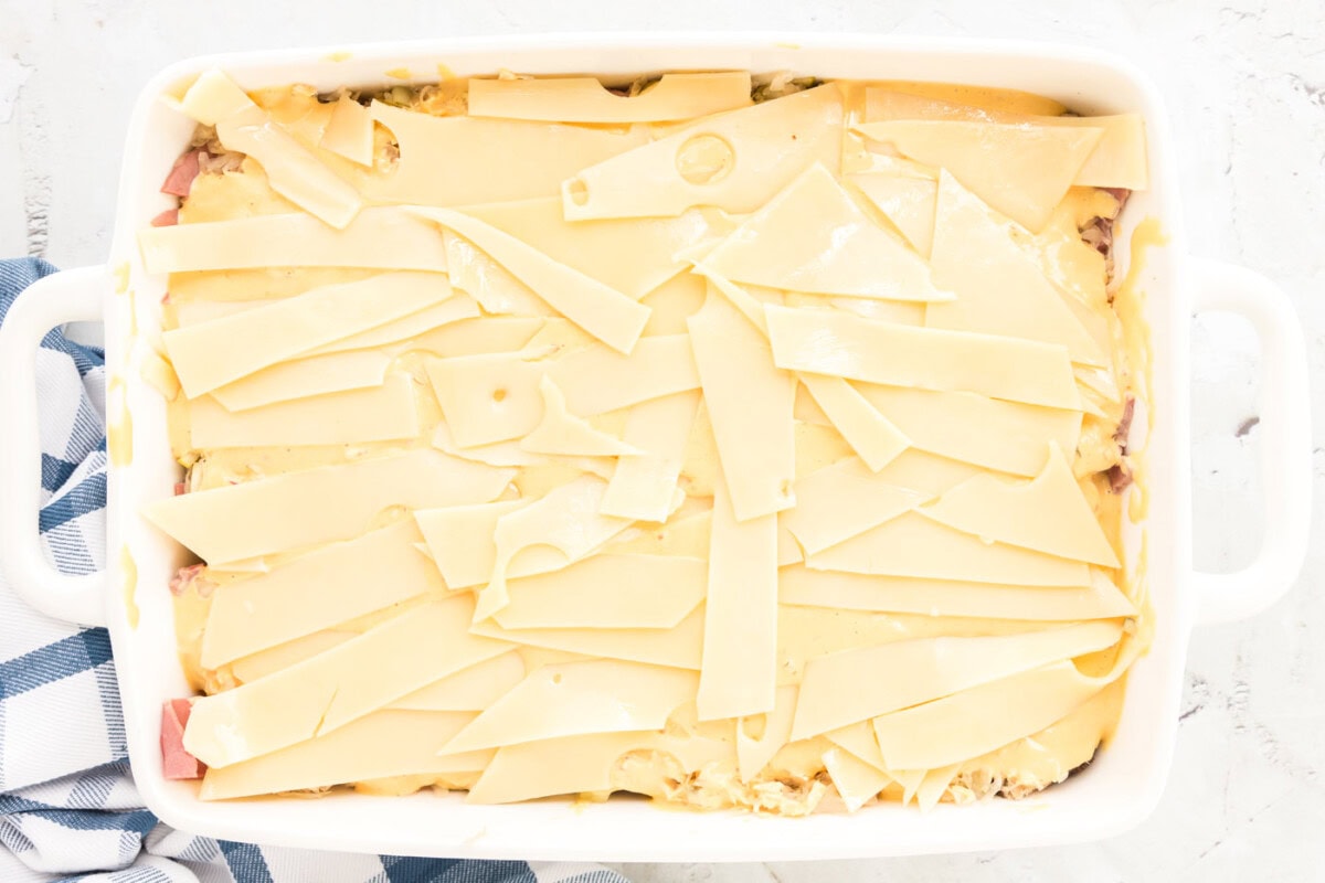 swiss cheese strips on top of thousand island dressing for reuben casserole