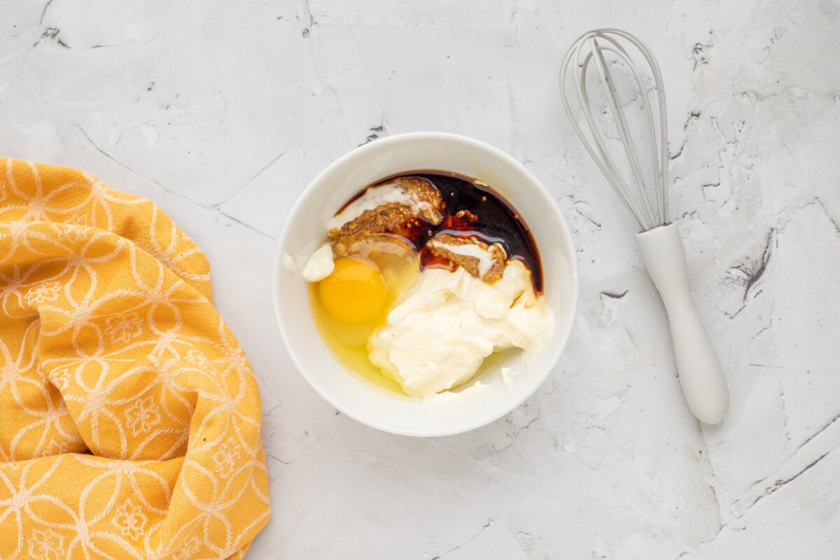 mayonnaise, soy sauce, ground mustard, egg, and horseradish mayo in a bowl