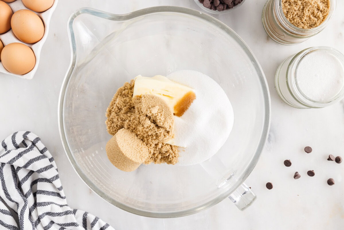 butter, sugars, and vanilla in a bowl of a stand mixer