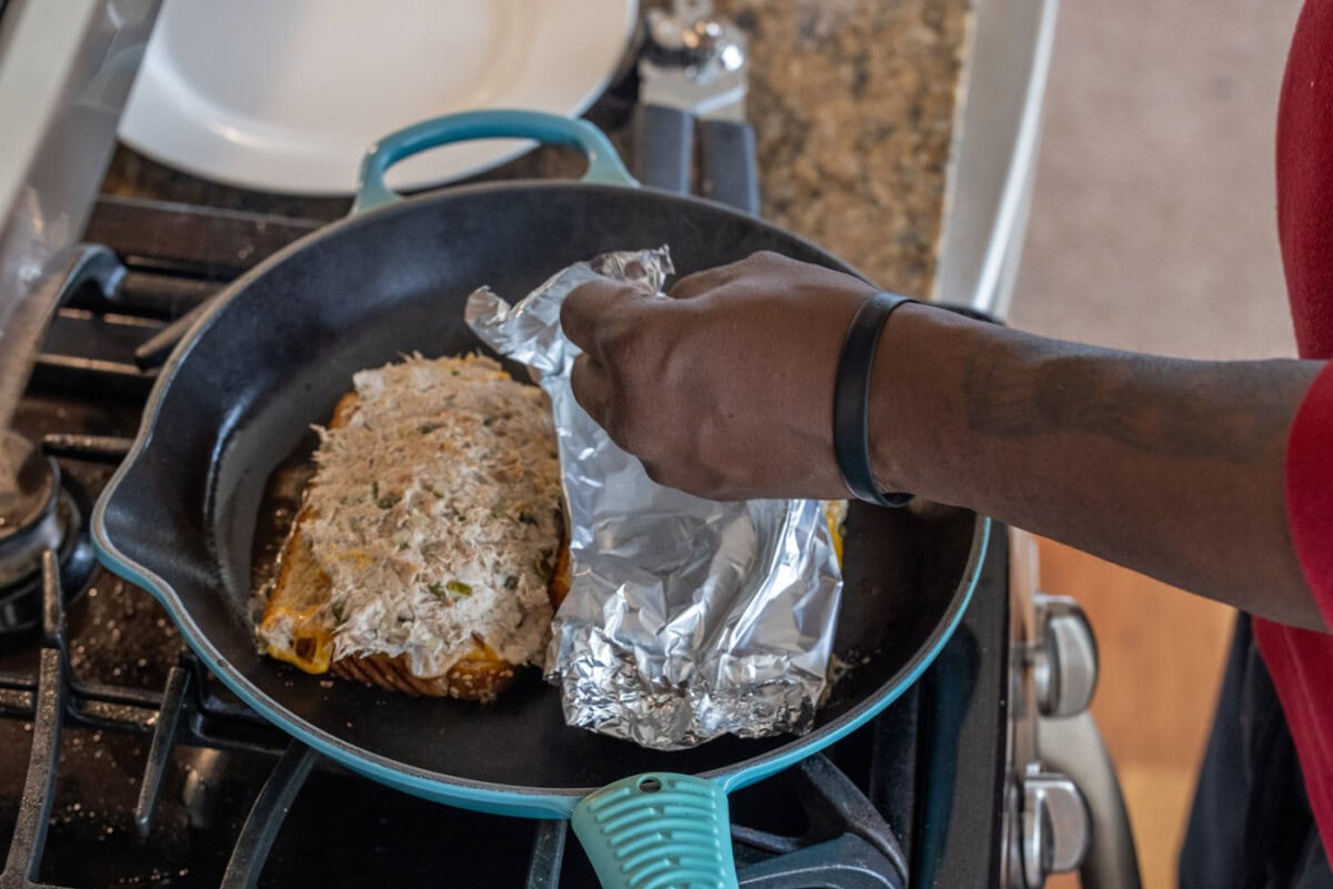 lifting foil from tuna melt