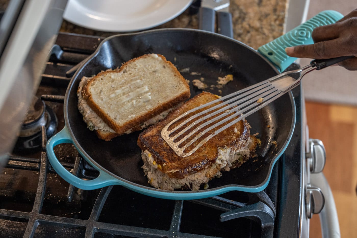 flipping tuna melts in a skillet