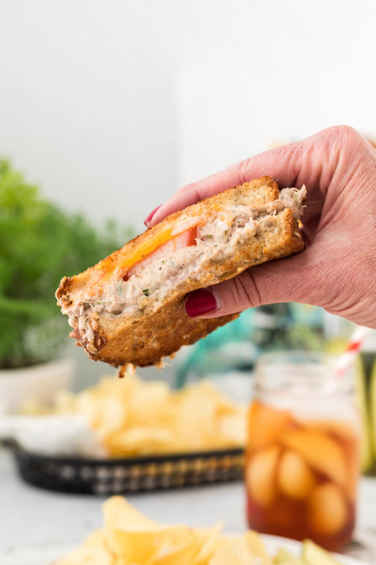 hand holding a Tuna Melt