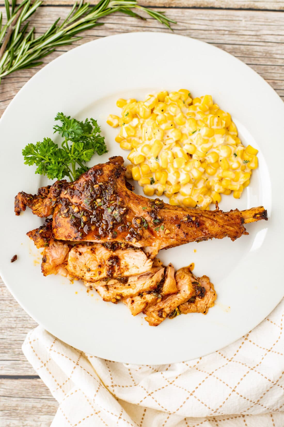 Veal Chop on a plate with creamed corn