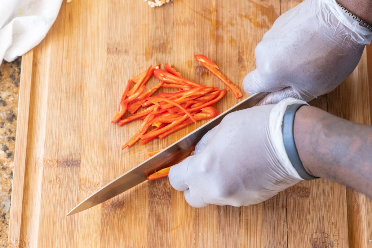 julienning red jalapenos