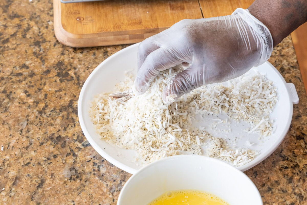 hand coating coconut shrimp