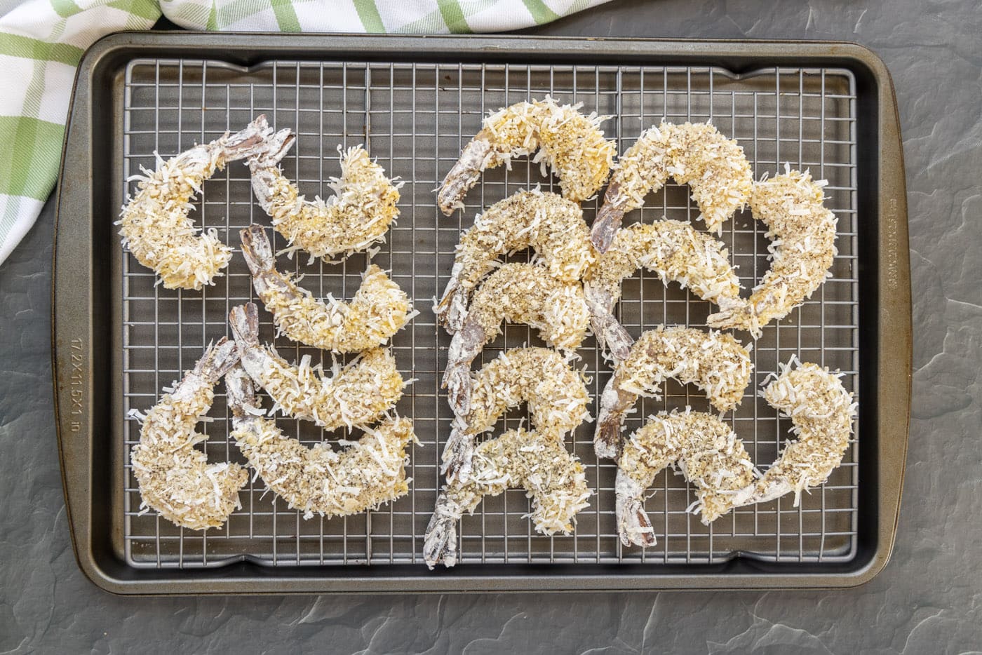 coconut shrimp on a wire baking sheet