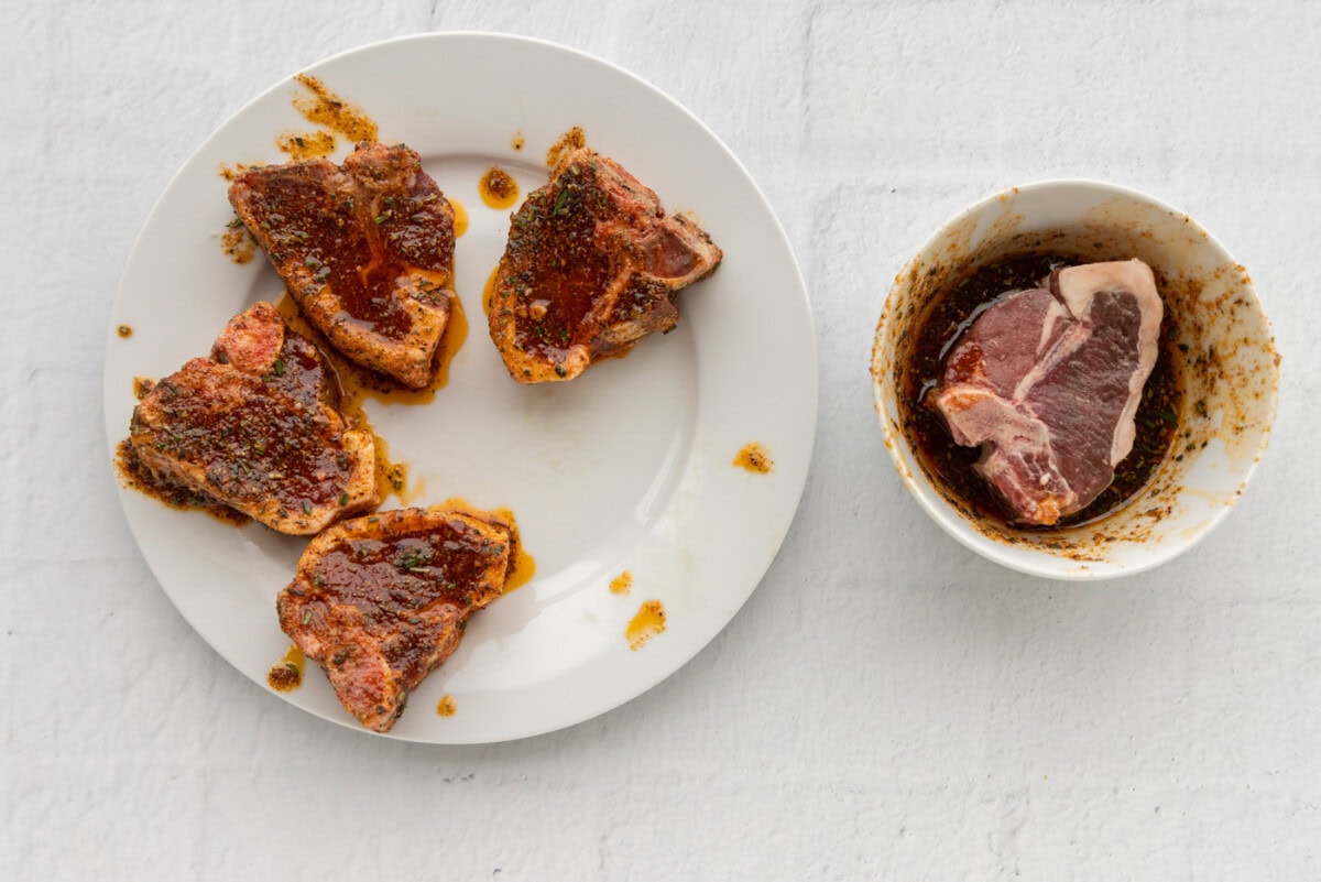 lamb chops with a wet rub on a plate