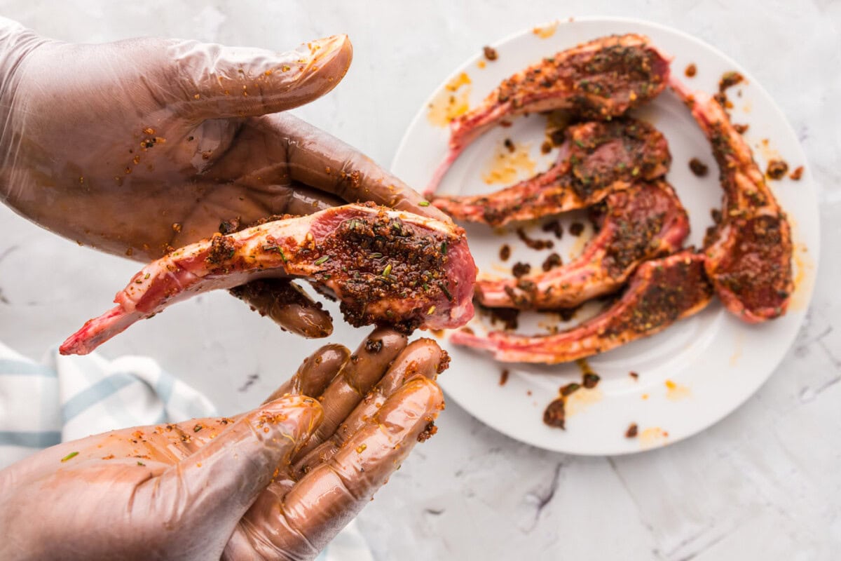 rubbing lamb chops with spices and oil
