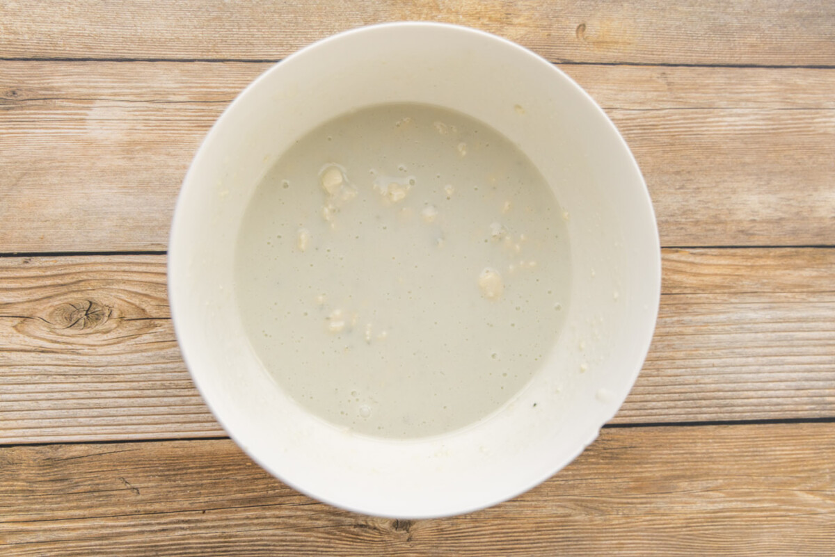 buttermilk and blue cheese crumbles in a mixing bowl