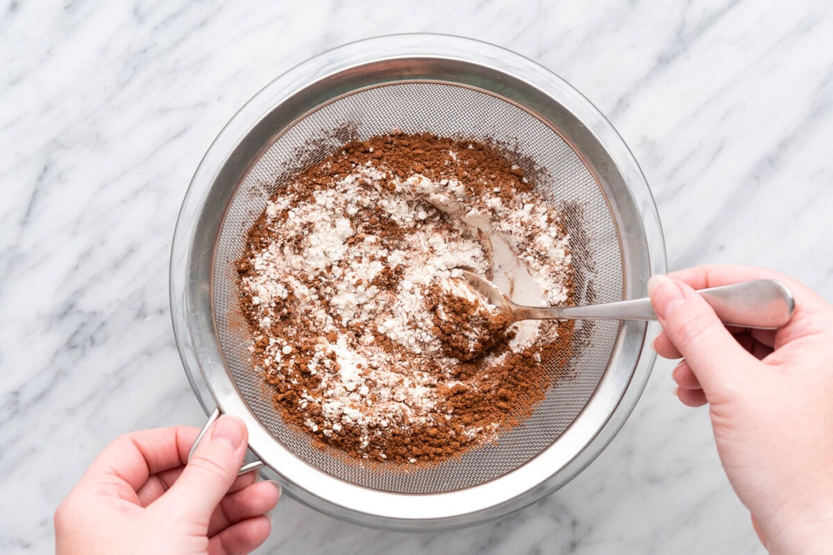 flour, cocoa powder, salt, and baking soda in a sieve
