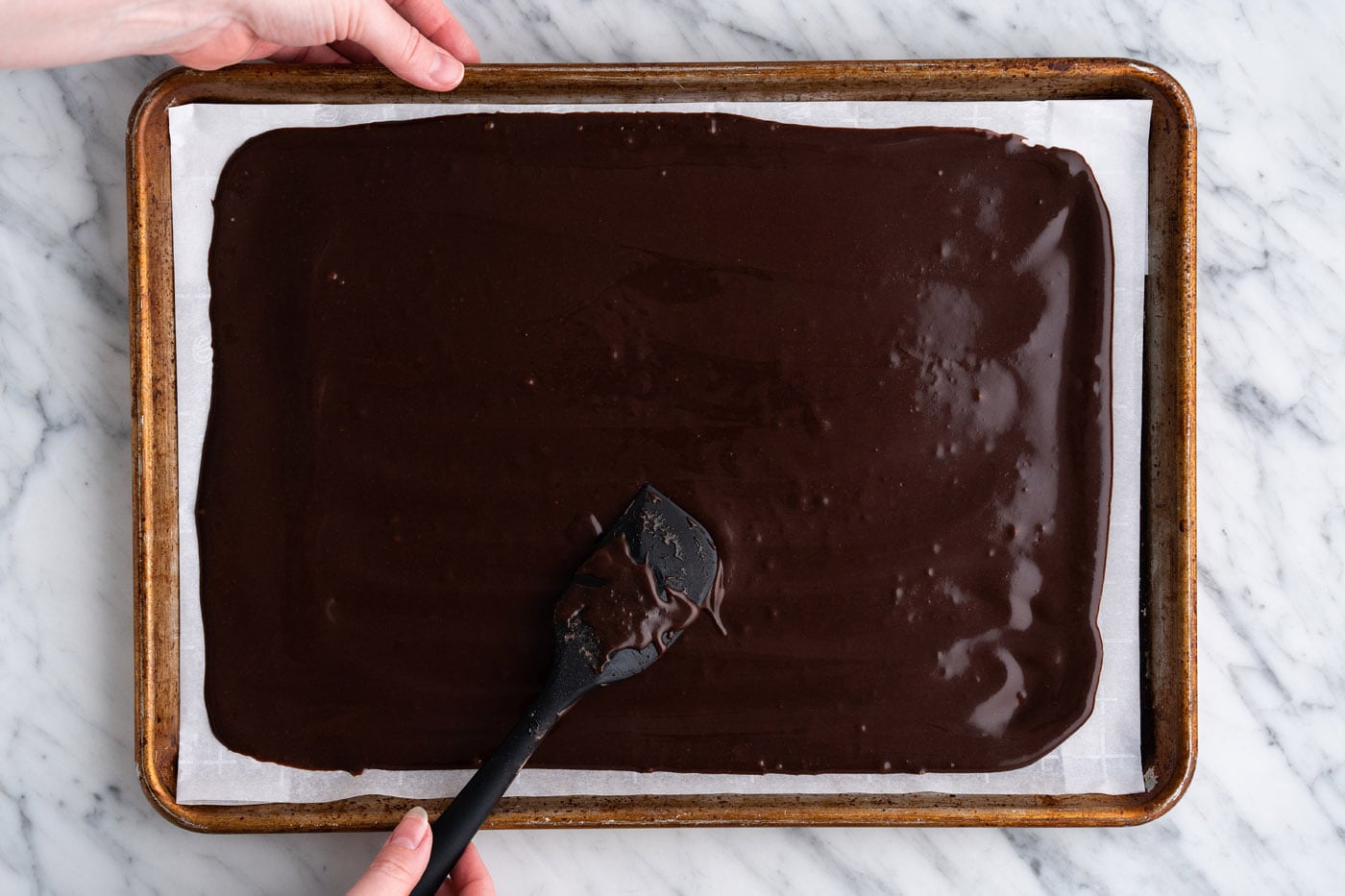 spreading chocolate batter out thin