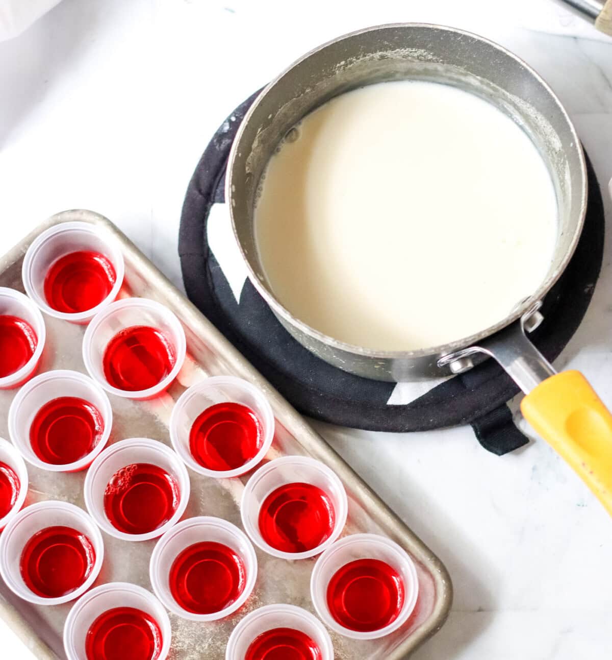 gelatin with sweetened condensed milk next to jello shots