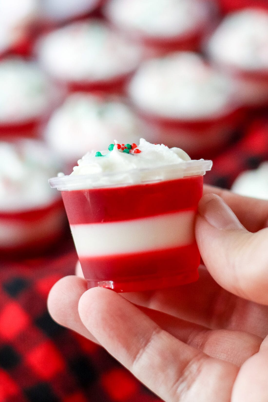 holding a Candy Cane Jello Shot