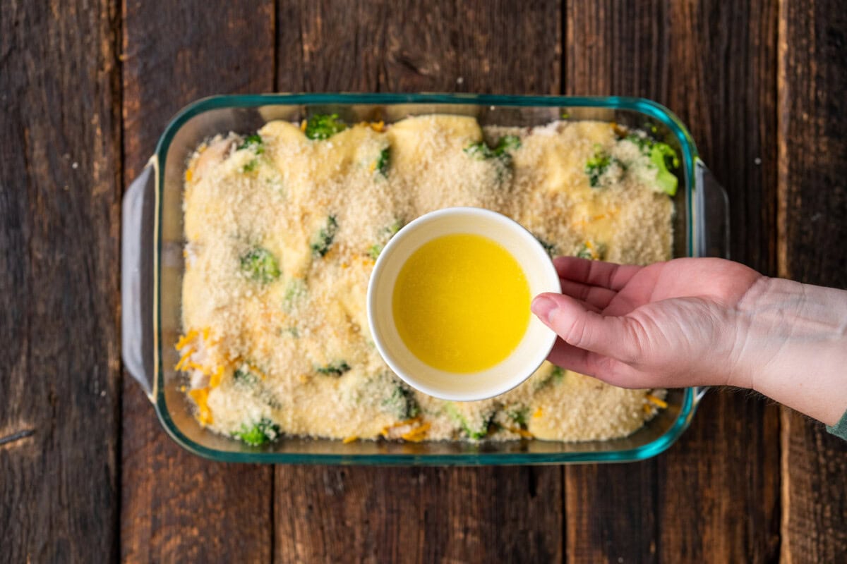drizzling butter over chicken divan casserole