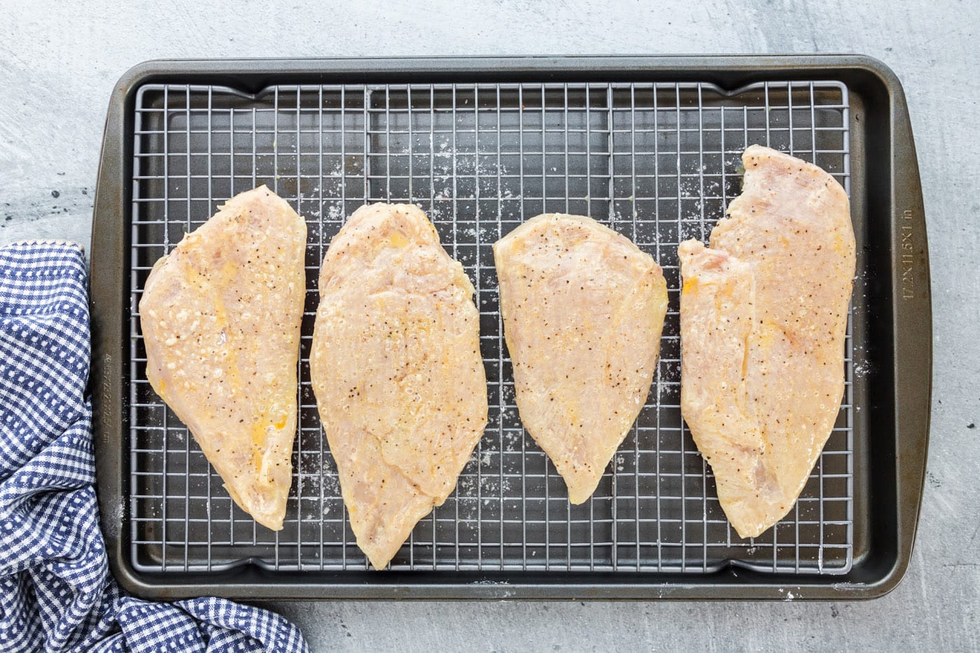 chicken breasts dredged in flour and egg