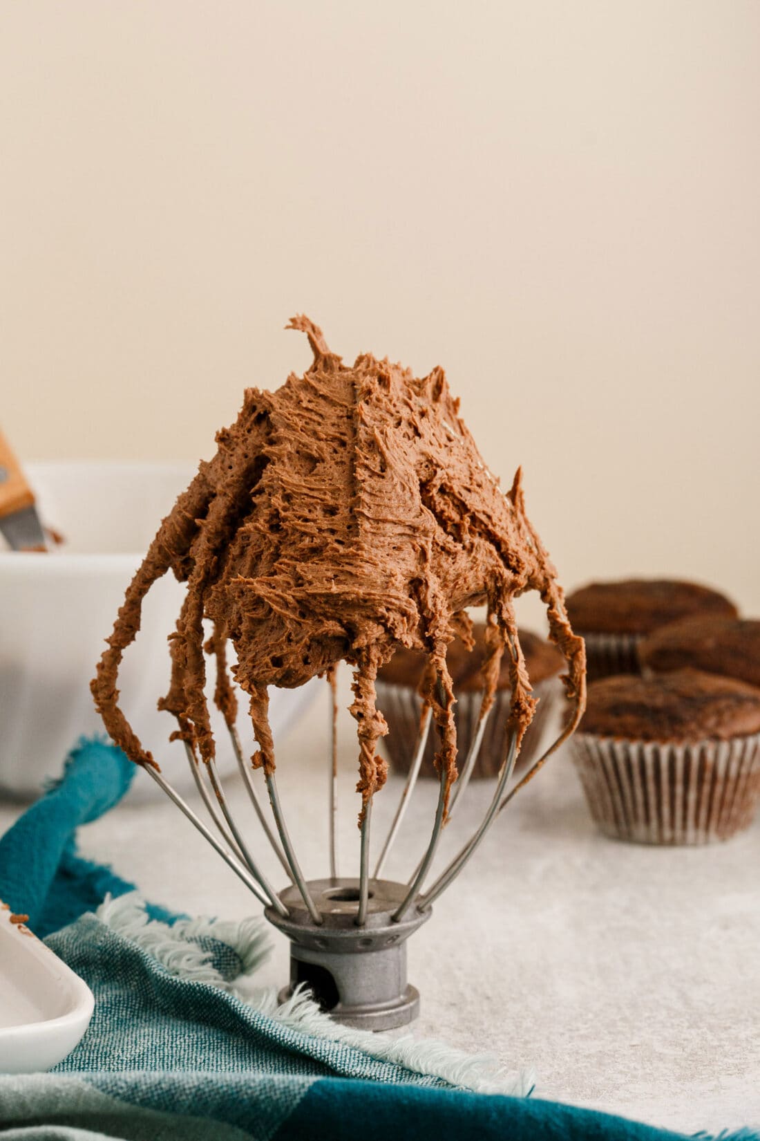 Chocolate Buttercream Frosting on a mixer whisk
