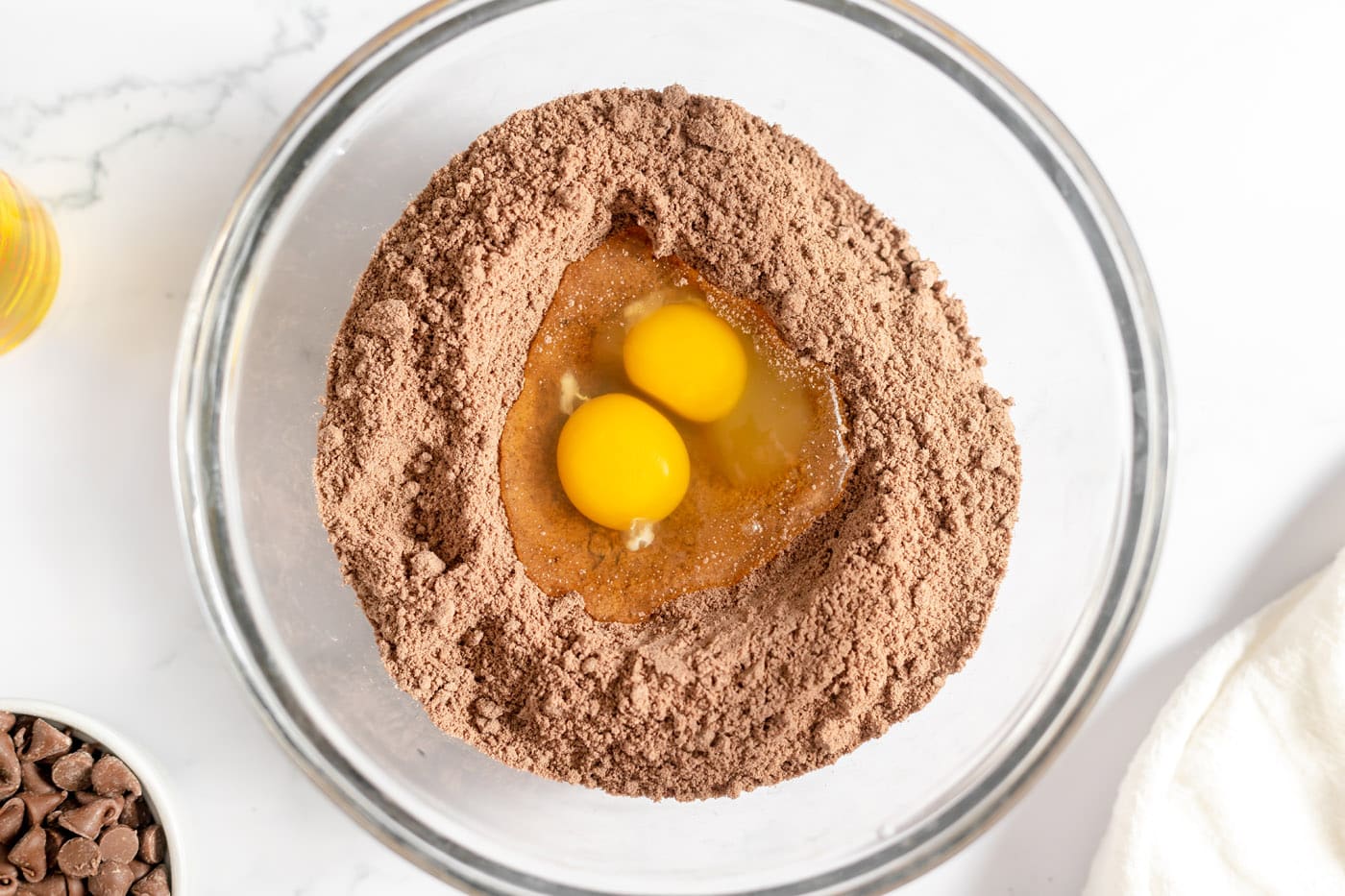 eggs in the center of cake mix in a bowl