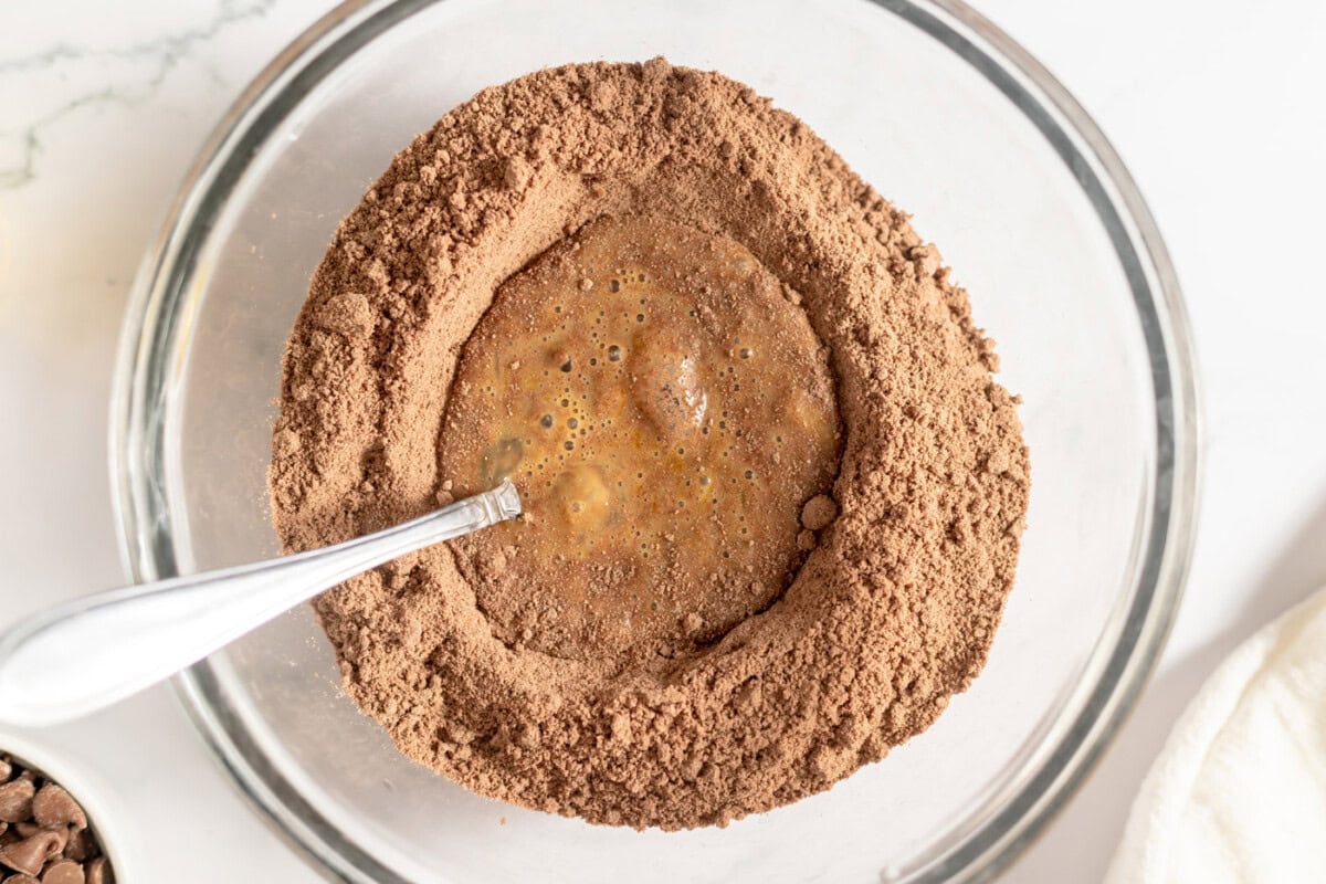 beaten eggs in the center of chocolate cake mix