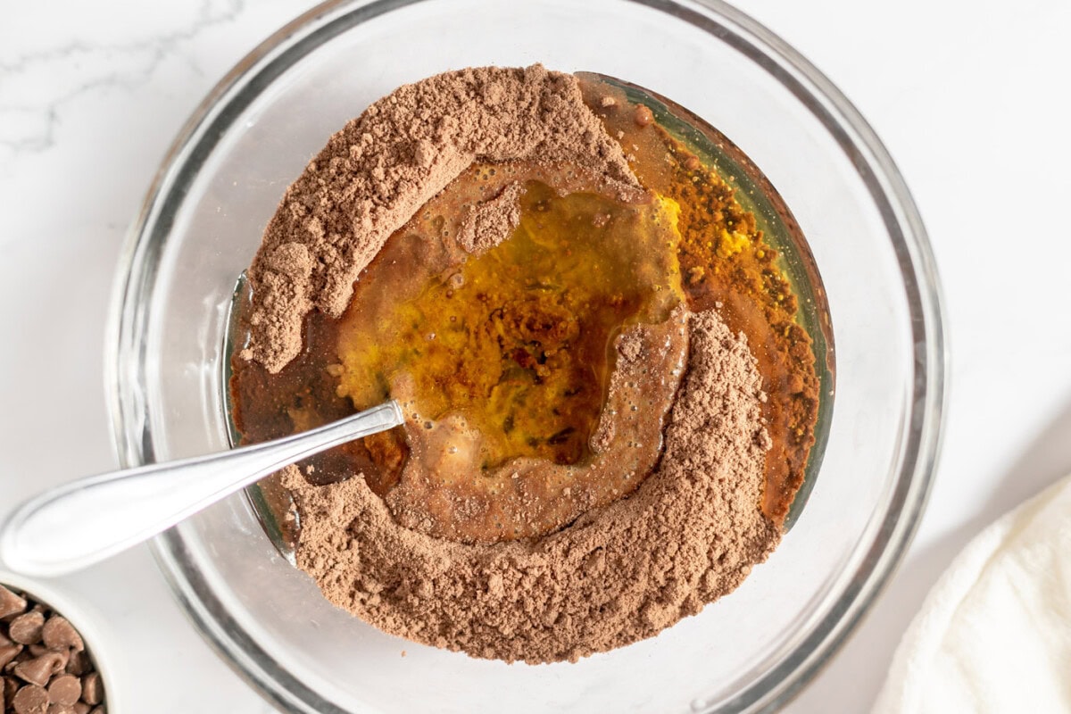 oil and eggs added to cake mix in a bowl