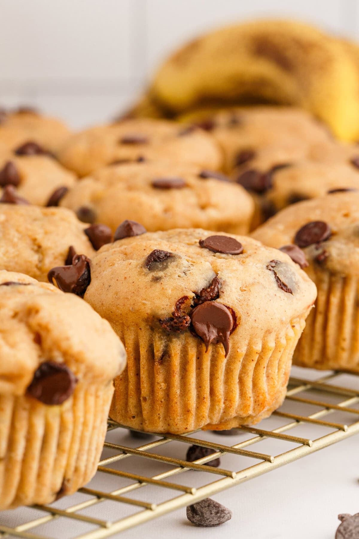 Chocolate Chip Banana Muffins on a wire rack