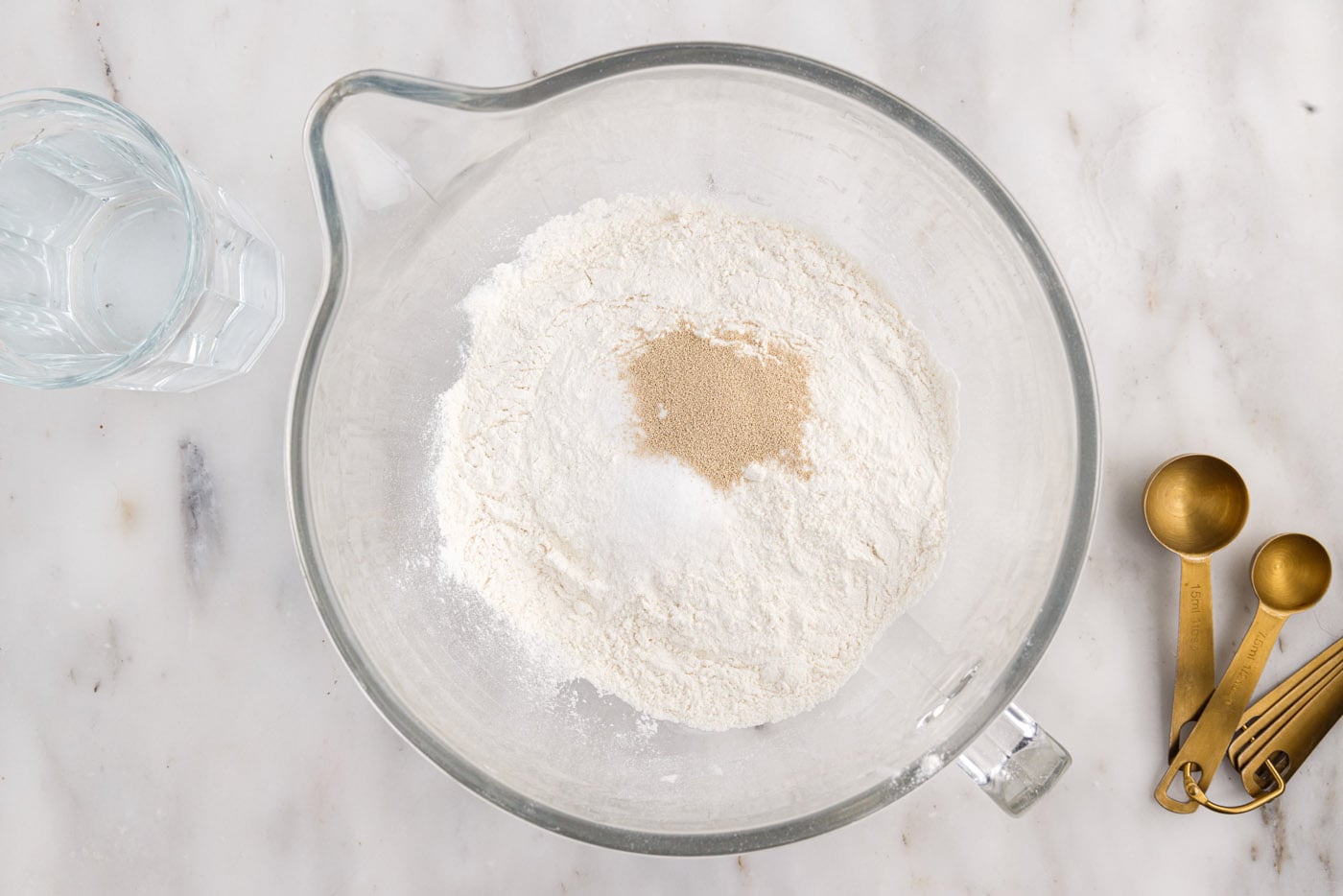 flour, salt, and yeast in a stand mixer bowl