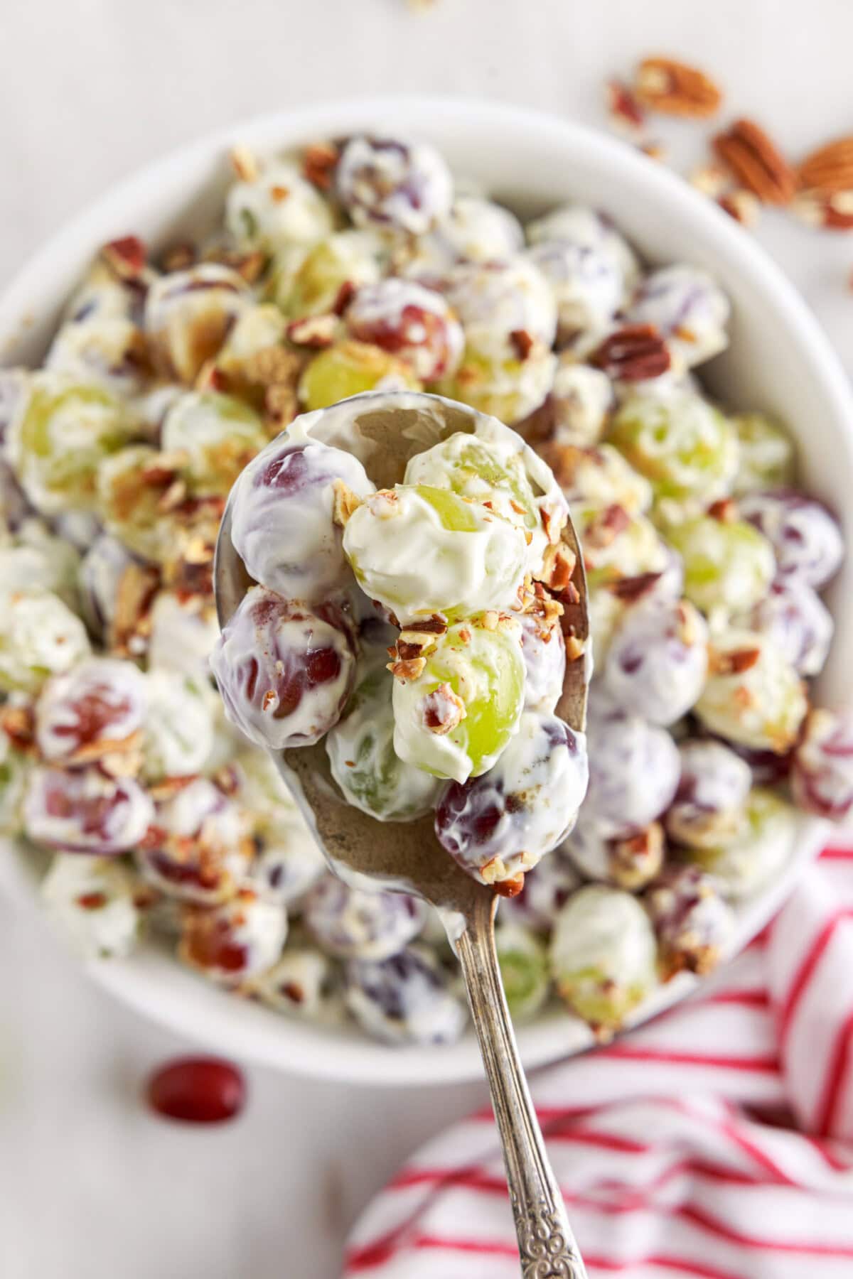 spoon of Grape Salad mover a bowl