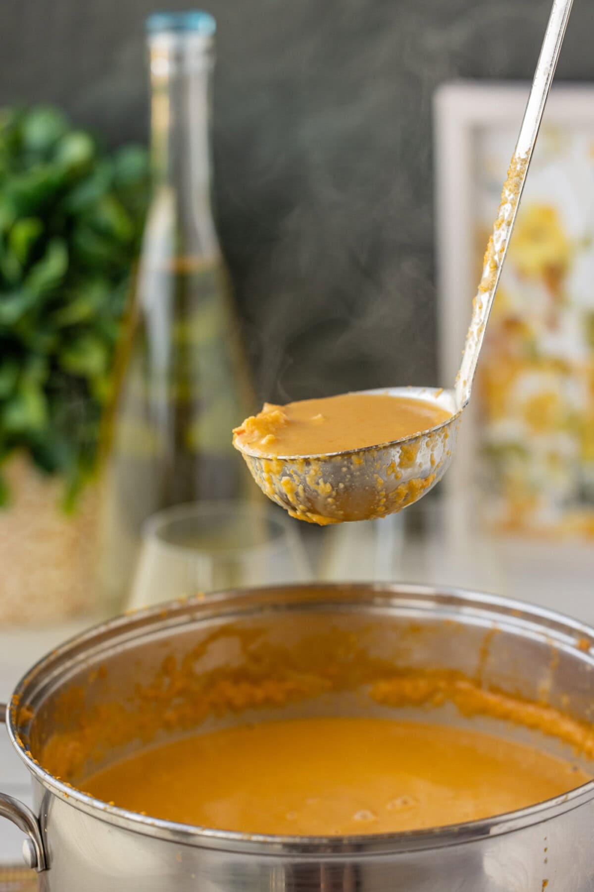 lifting a ladle of Lobster Bisque