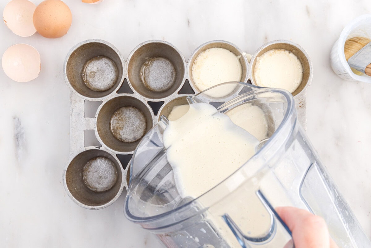 pouring batter into popover tin