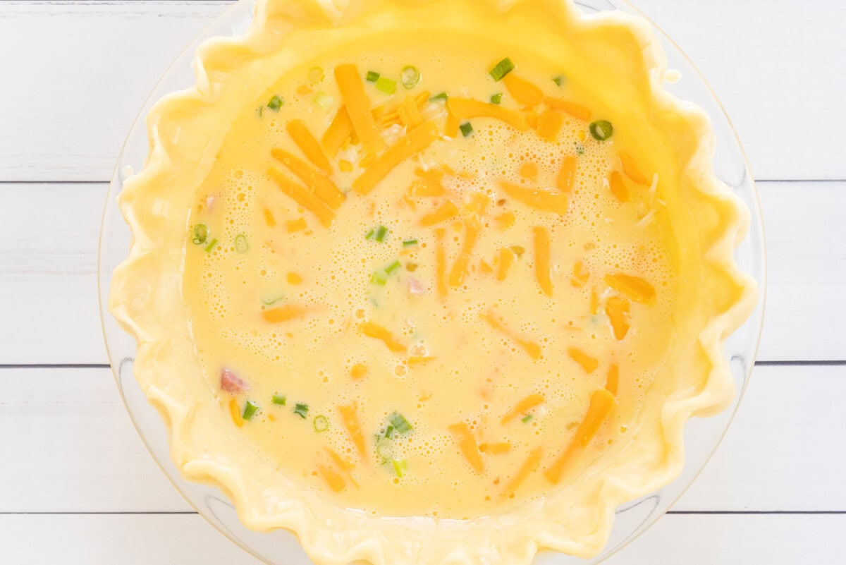 quiche ingredients in pie shell