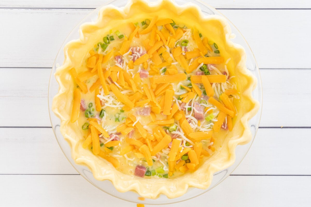 cheddar cheese and mozzarella on top of quiche