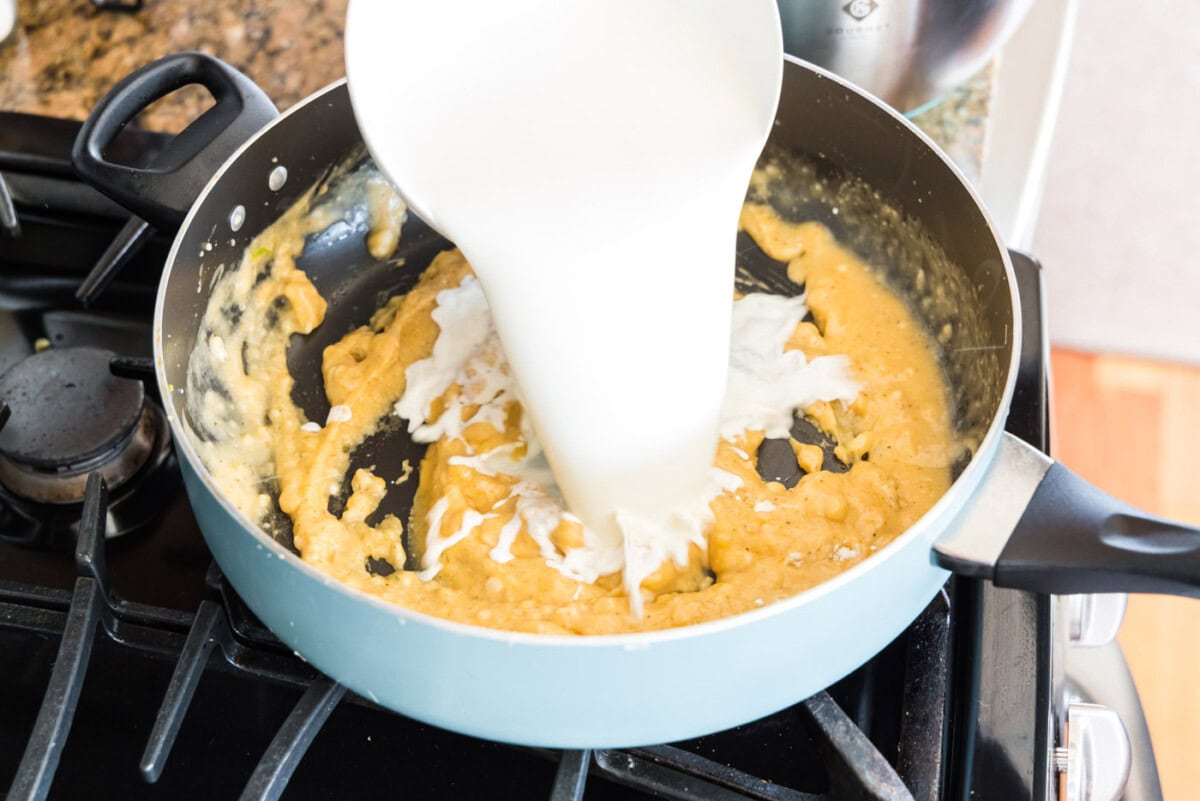 pouring half and half into pan