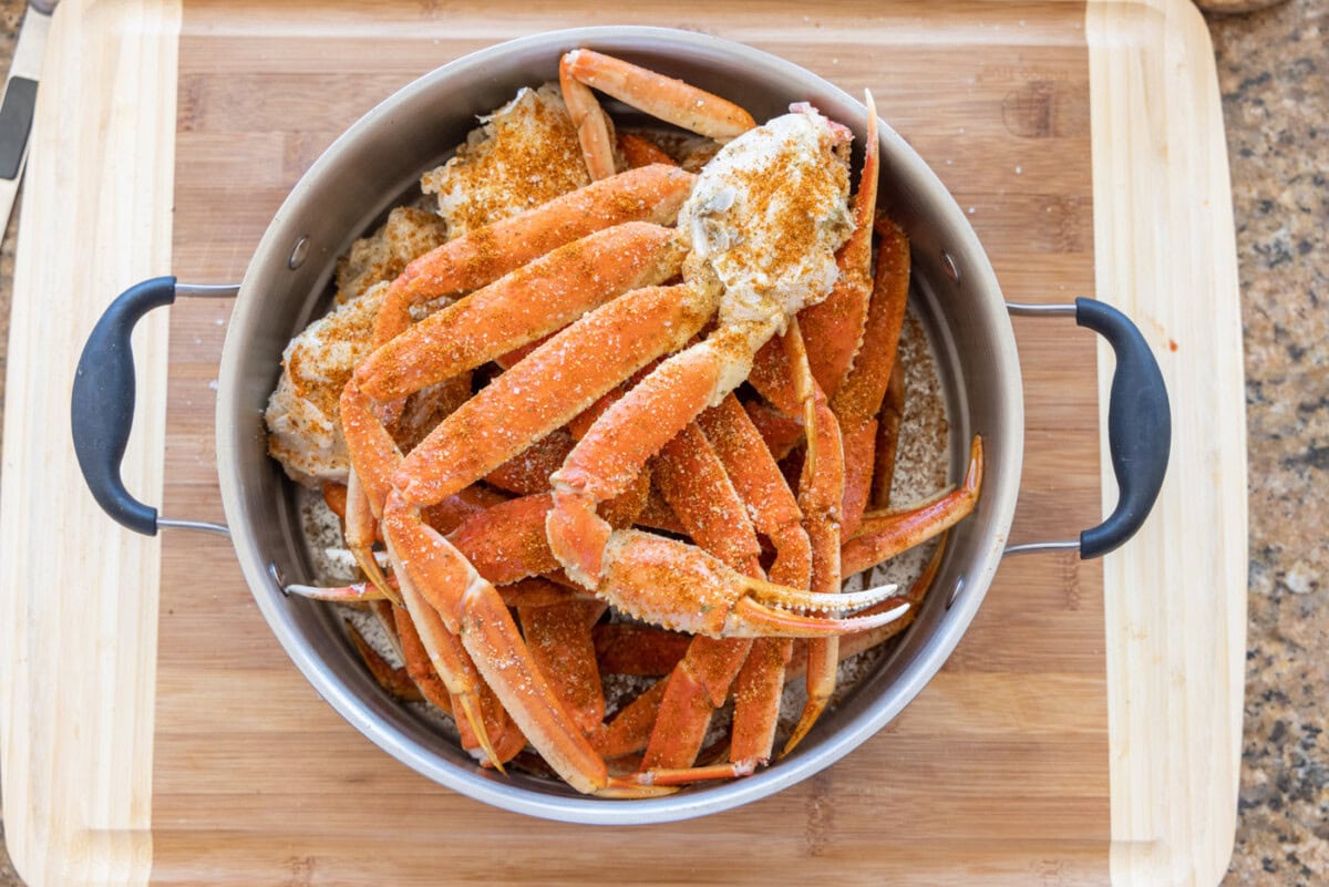 snow crab legs in a steamer basket