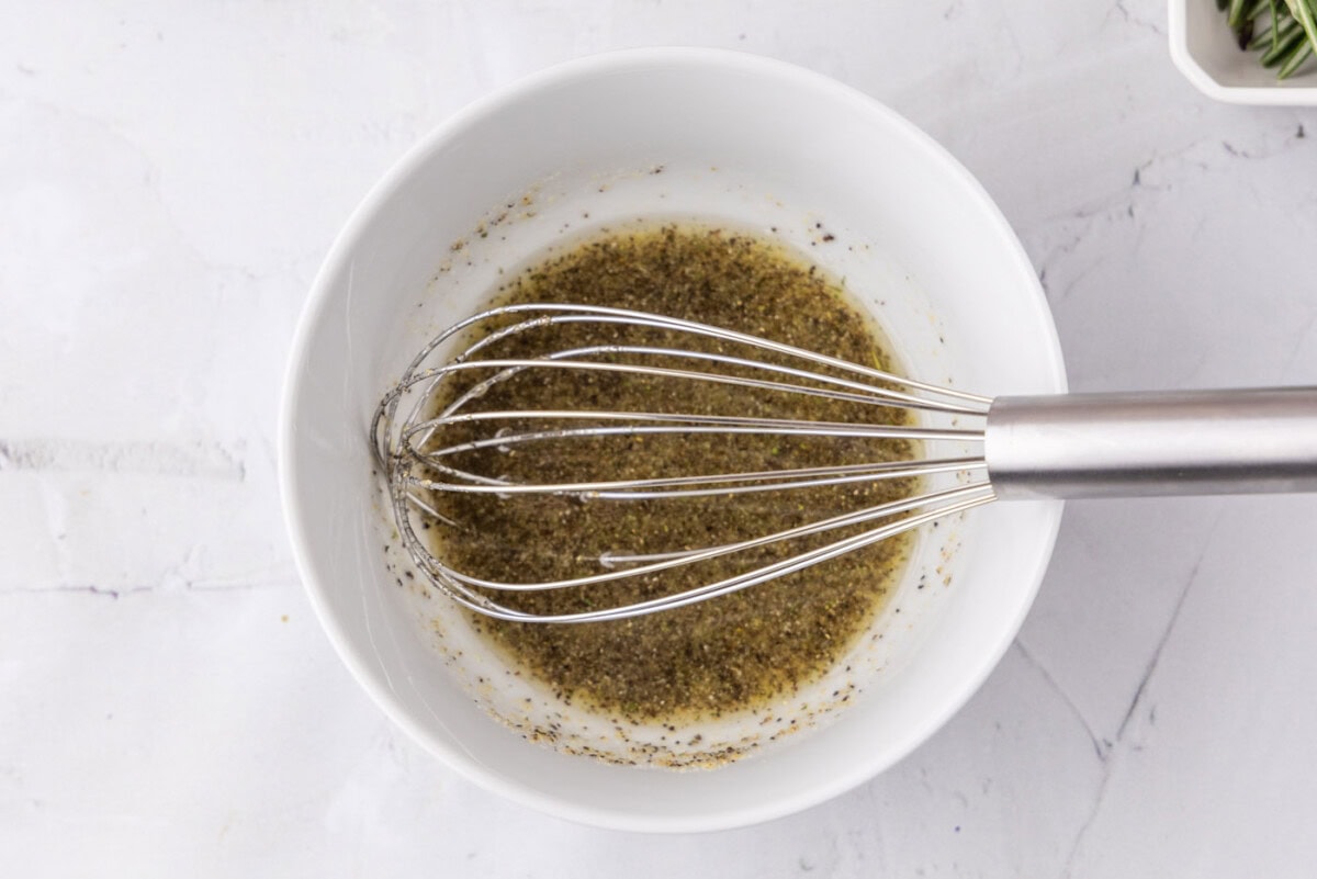 whisked olive oil, garlic salt, and pepper