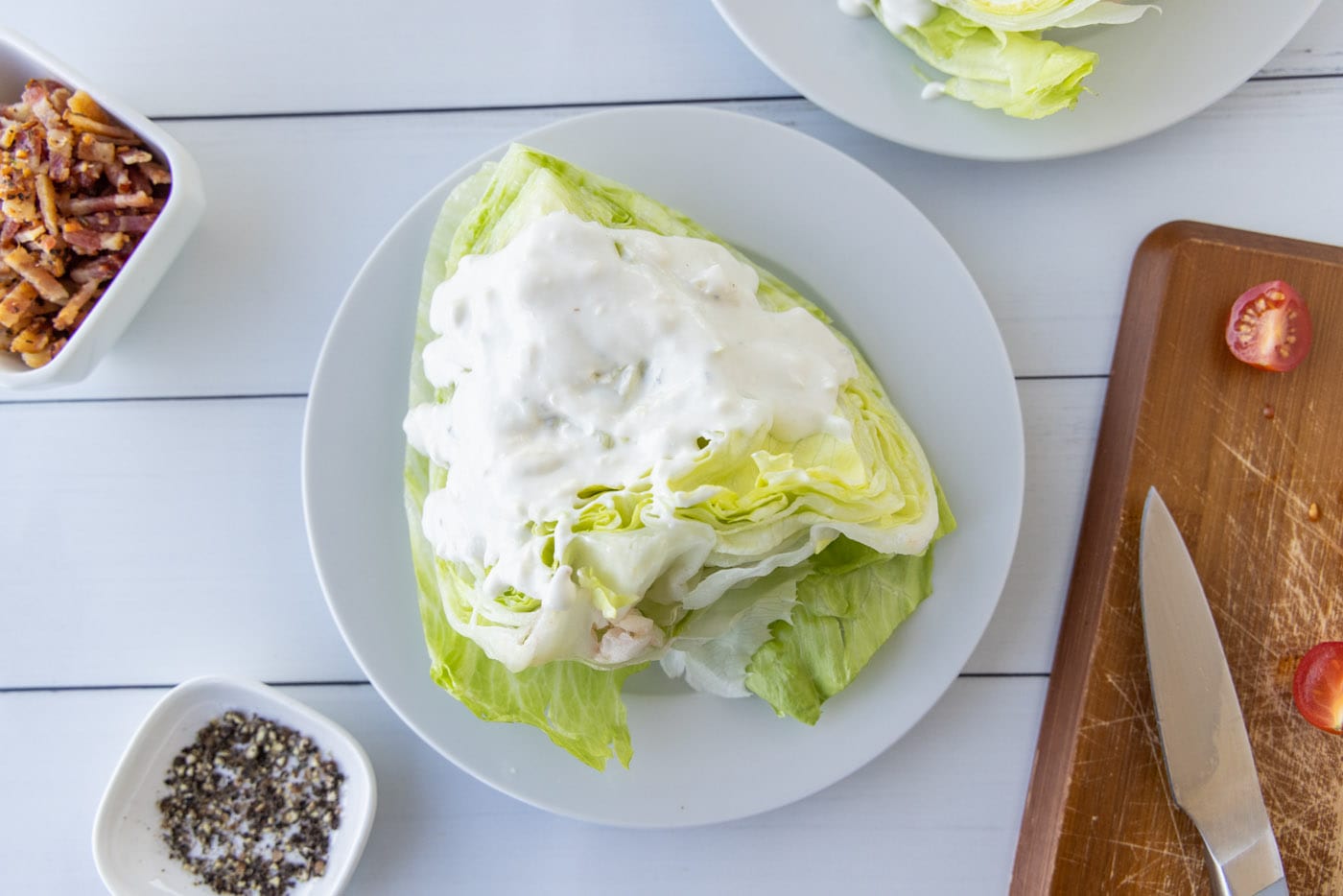 bleu cheese dressing on top of wedge salad