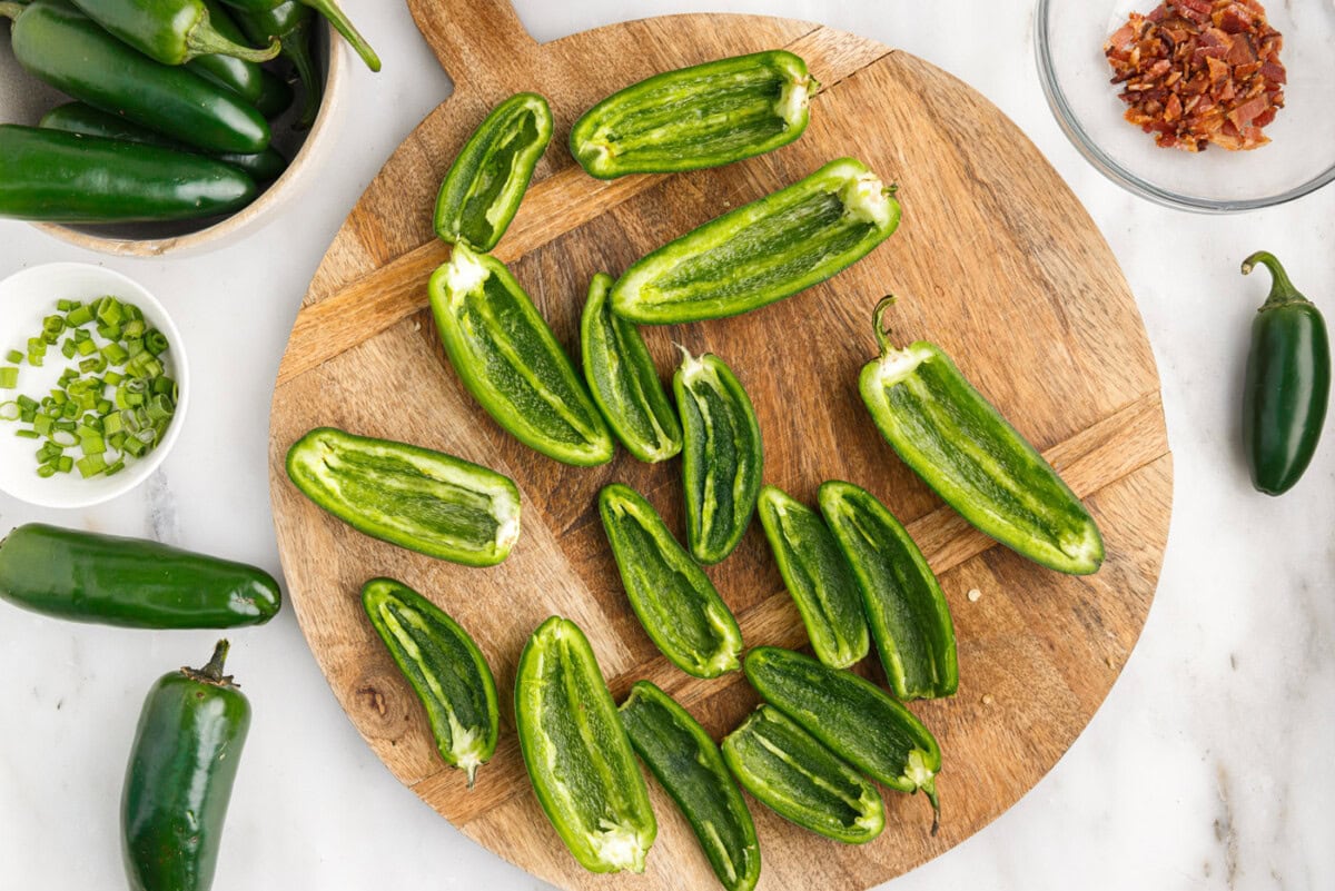 deseeded jalapeno peppers on a cutting board