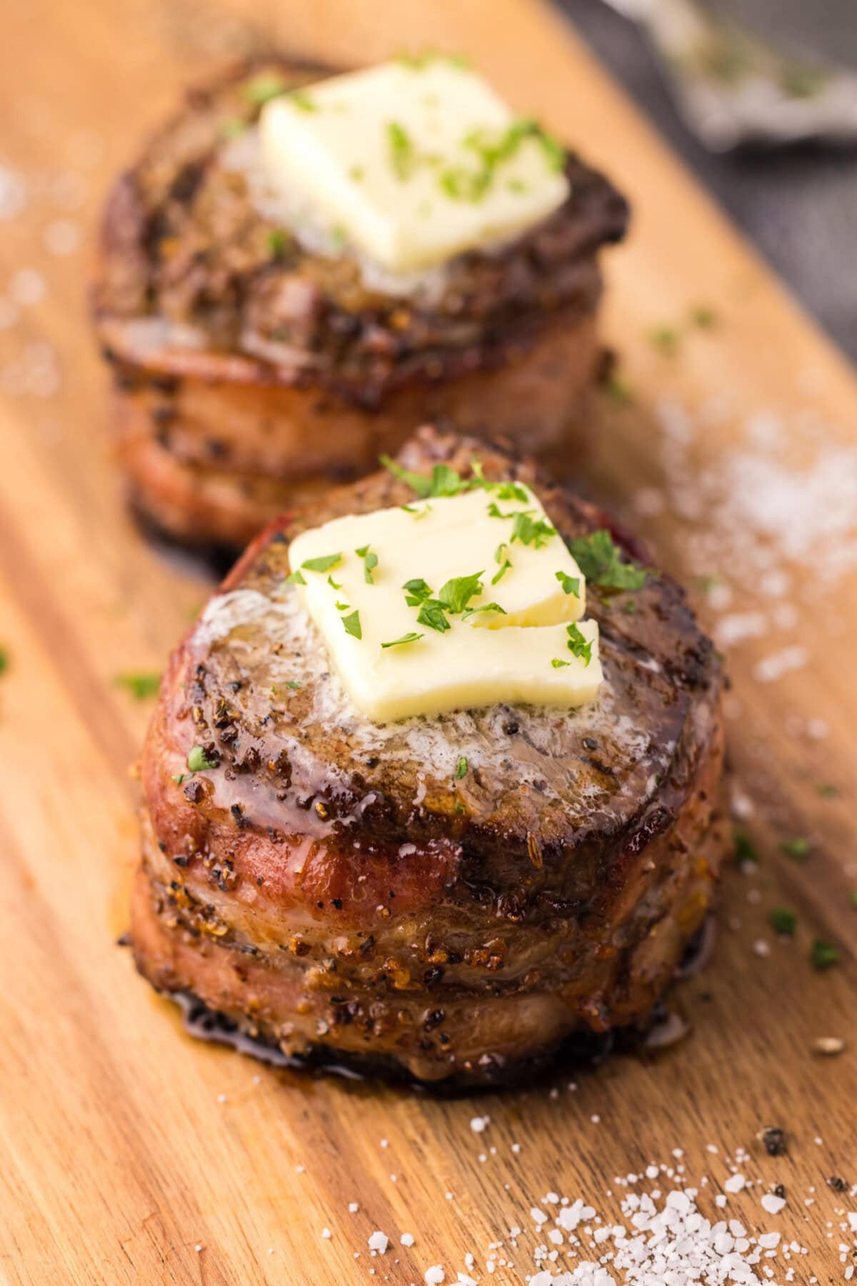 Two Bacon Wrapped Filet Mignon on a platter