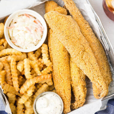 Fried Whiting Fish in a metal serving dish with fries