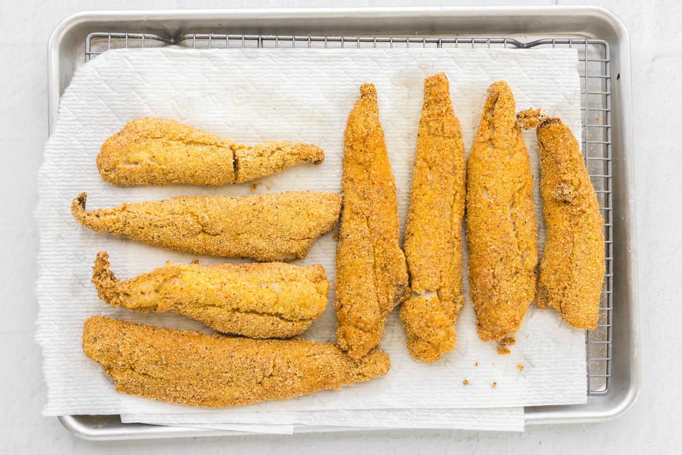 fried whiting fish on paper towels