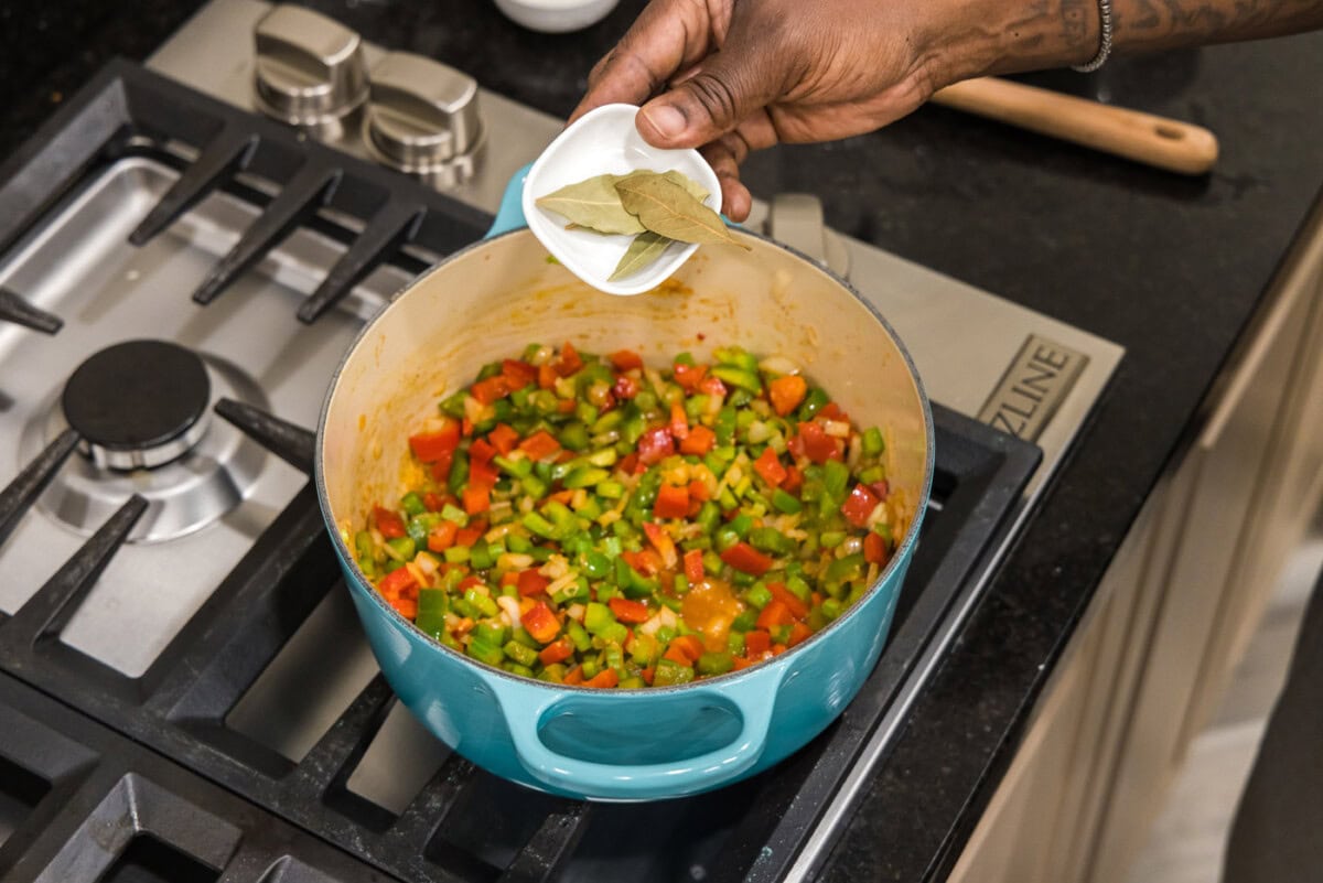 bay leaves over dutch oven with vegetables