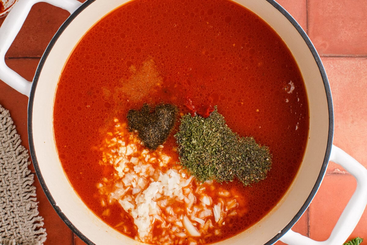 Italian herbs and seasonings added to marinara with beef and sausage