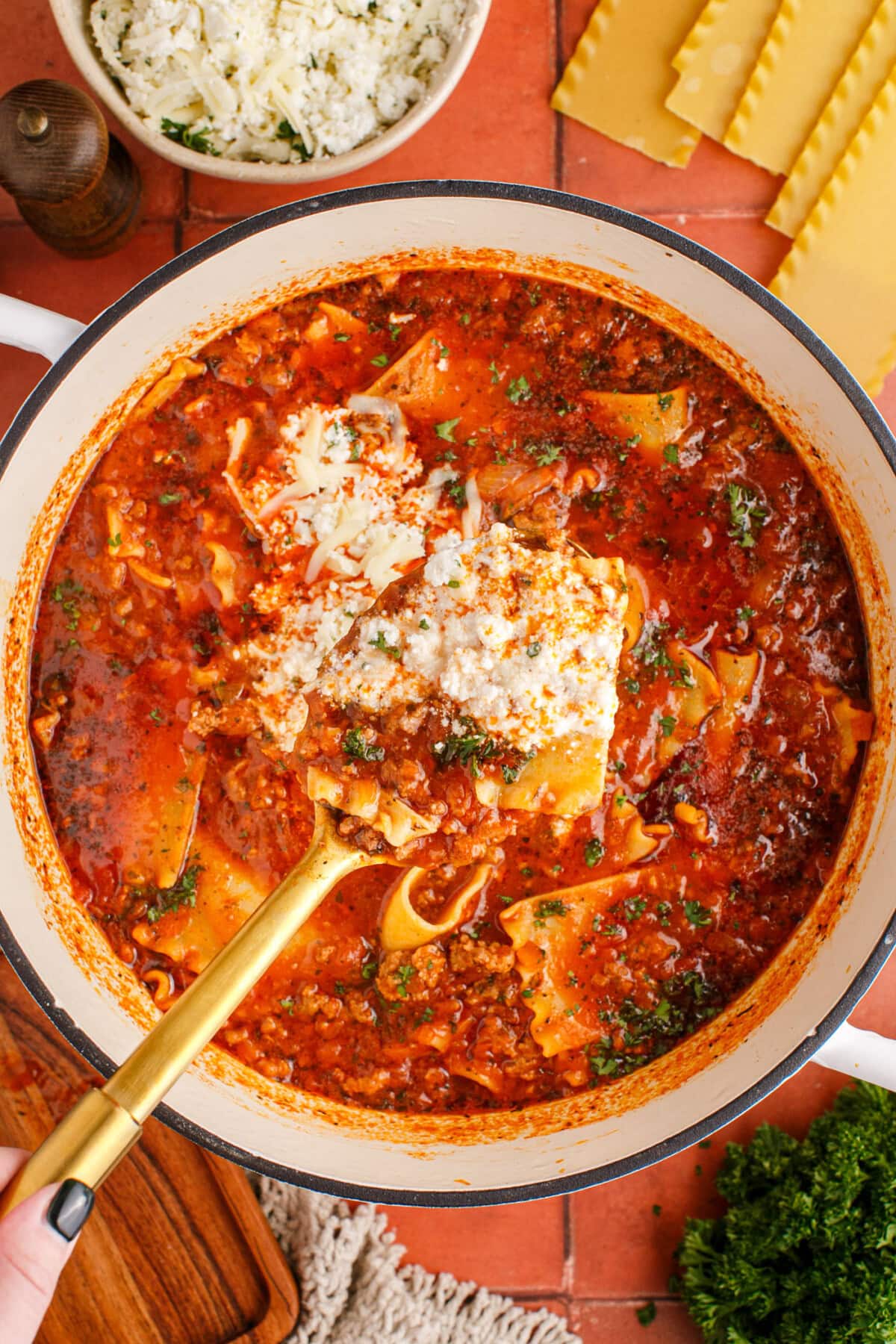 Spoonful of Lasagna Soup  over pot of Lasagna Soup 