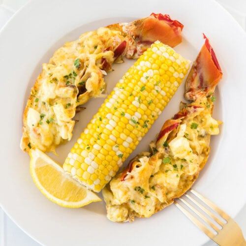 Lobster Thermidor on a plate with corn on the cob