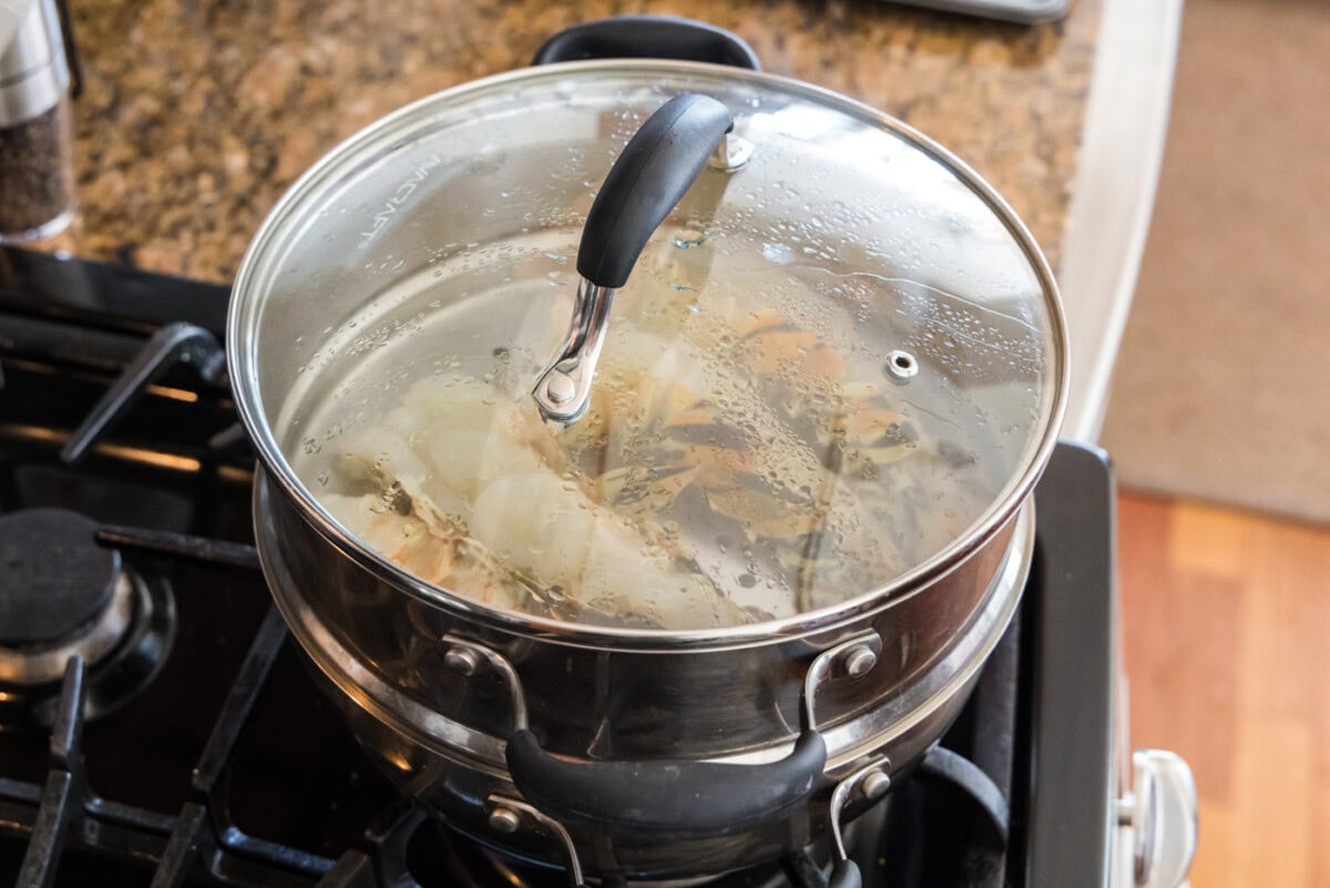 lobster tails steaming in a pot