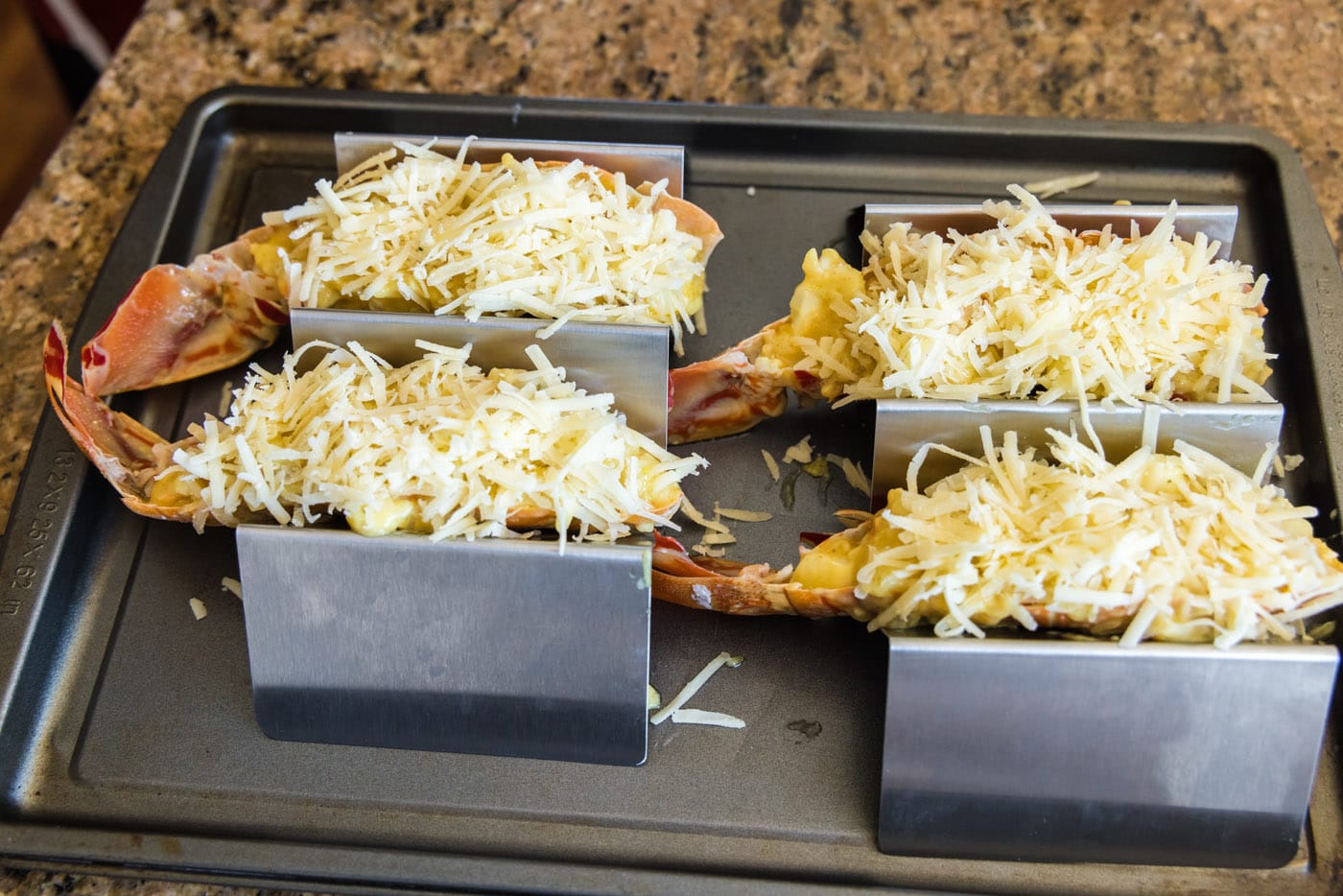 lobster thermidor topped with shredded gruyere cheese