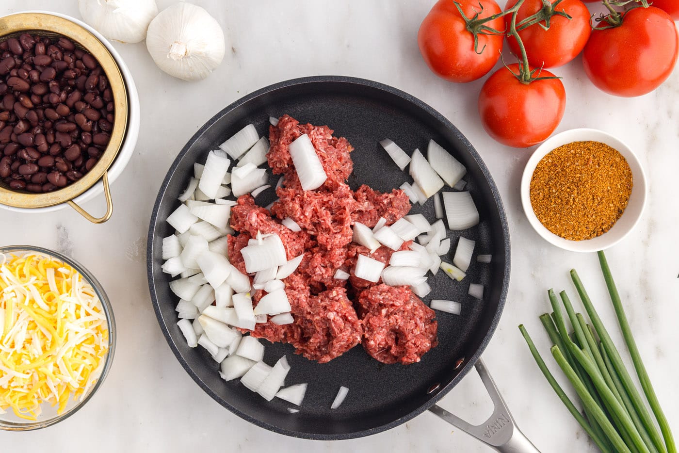ground beef and onion in a skillet