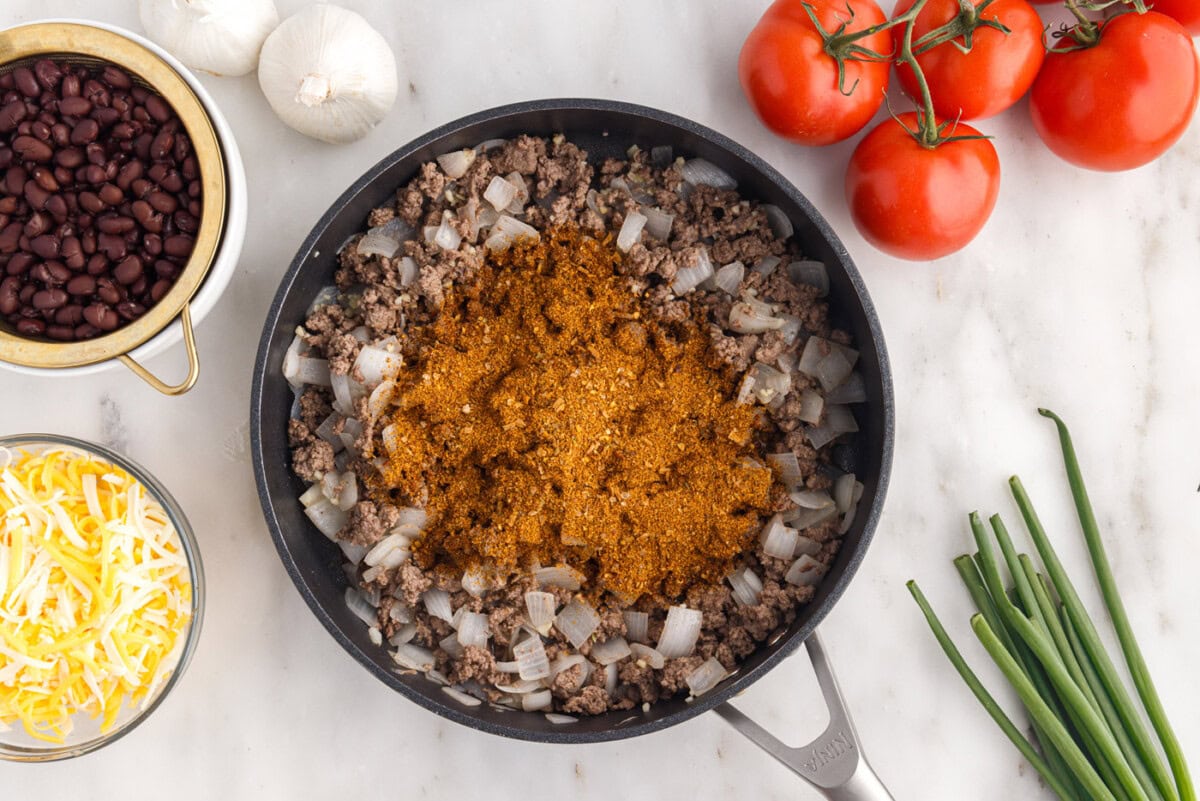 taco seasoning over ground beef and onion mixture