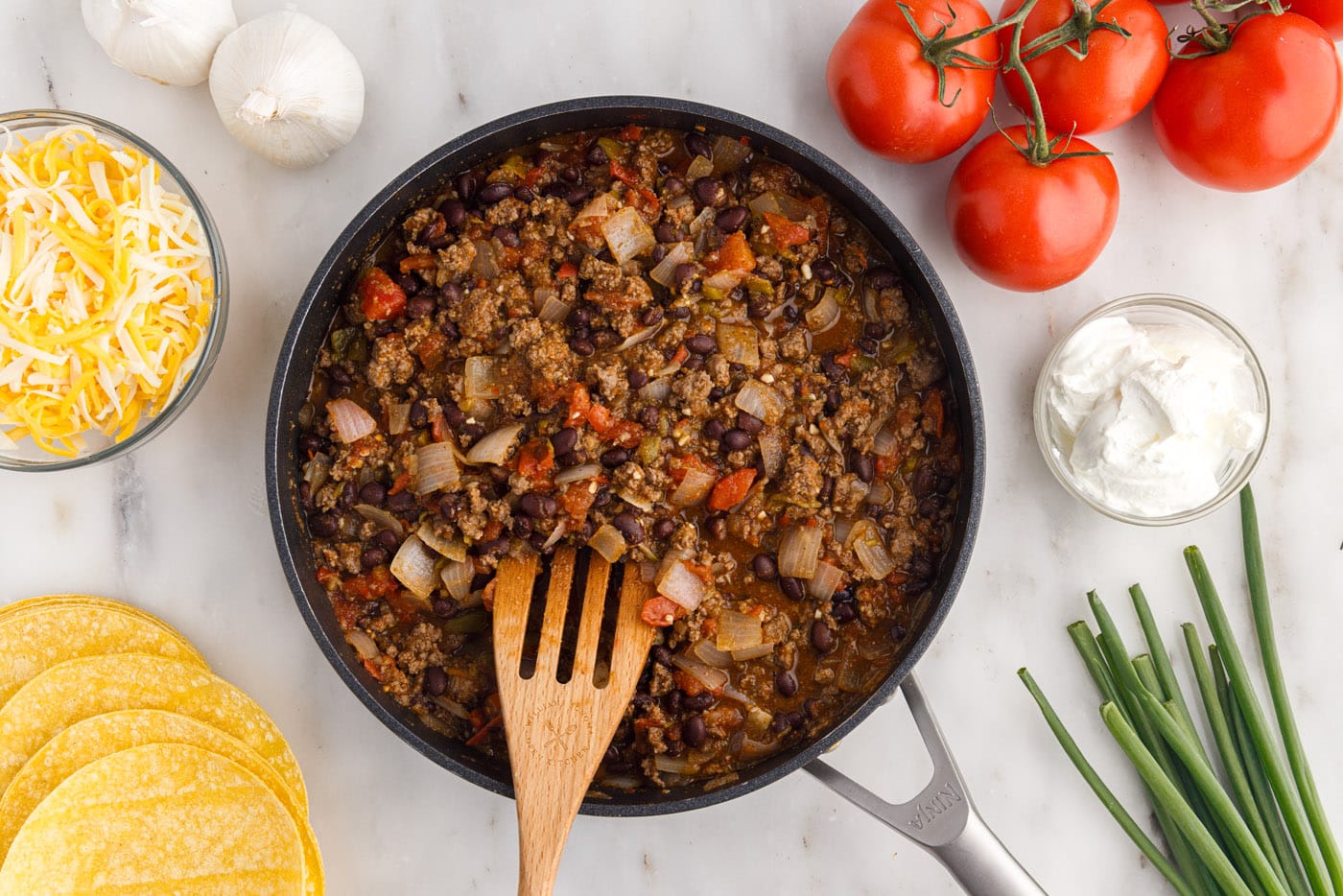 Mexican lasagna ground beef mixture in a skillet