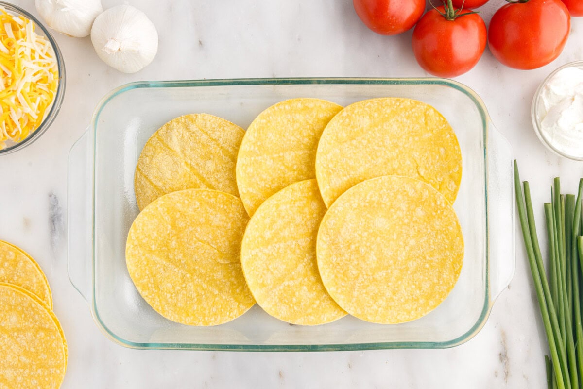 corn tortillas in a baking dish