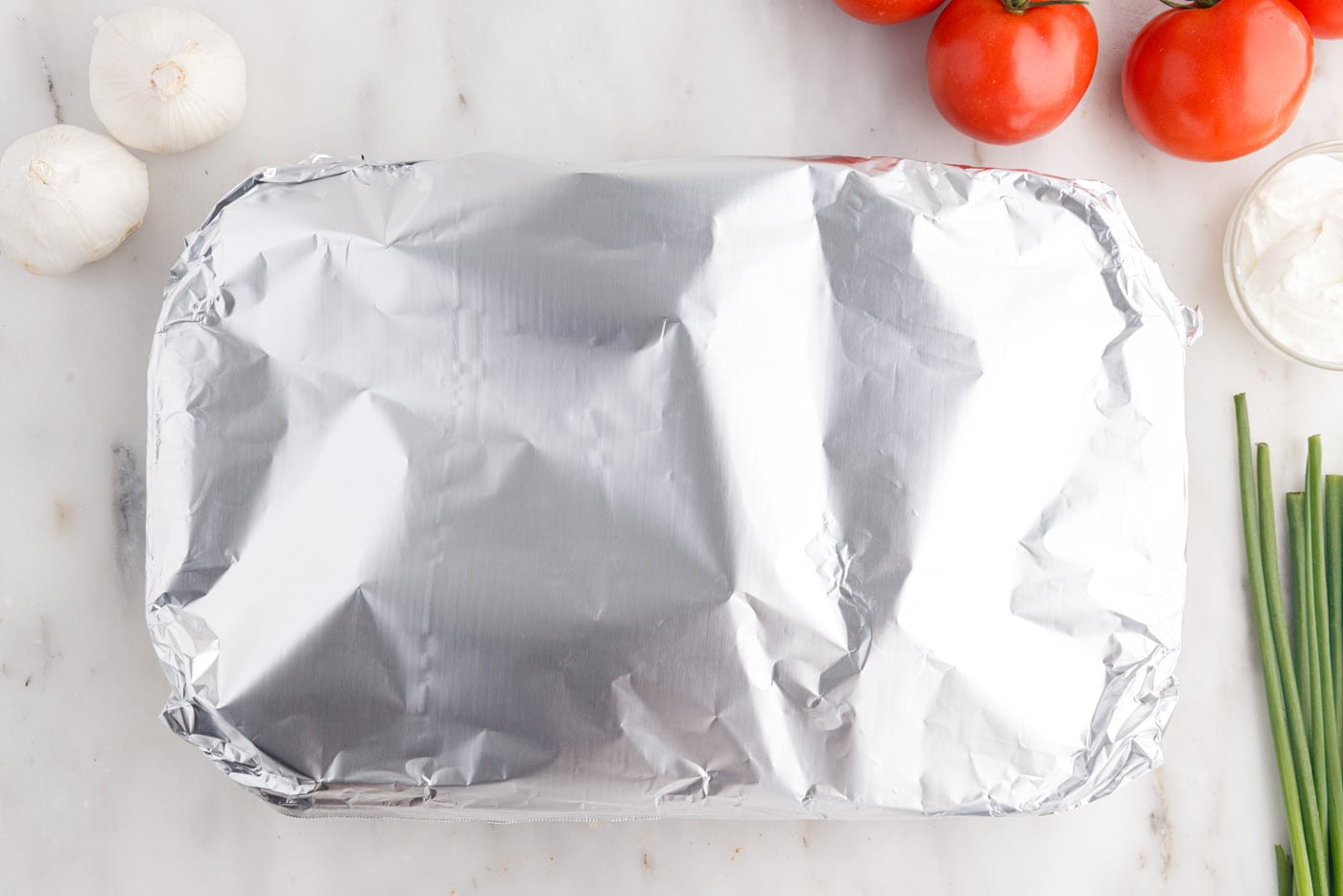 aluminum foil over mexican lasagna